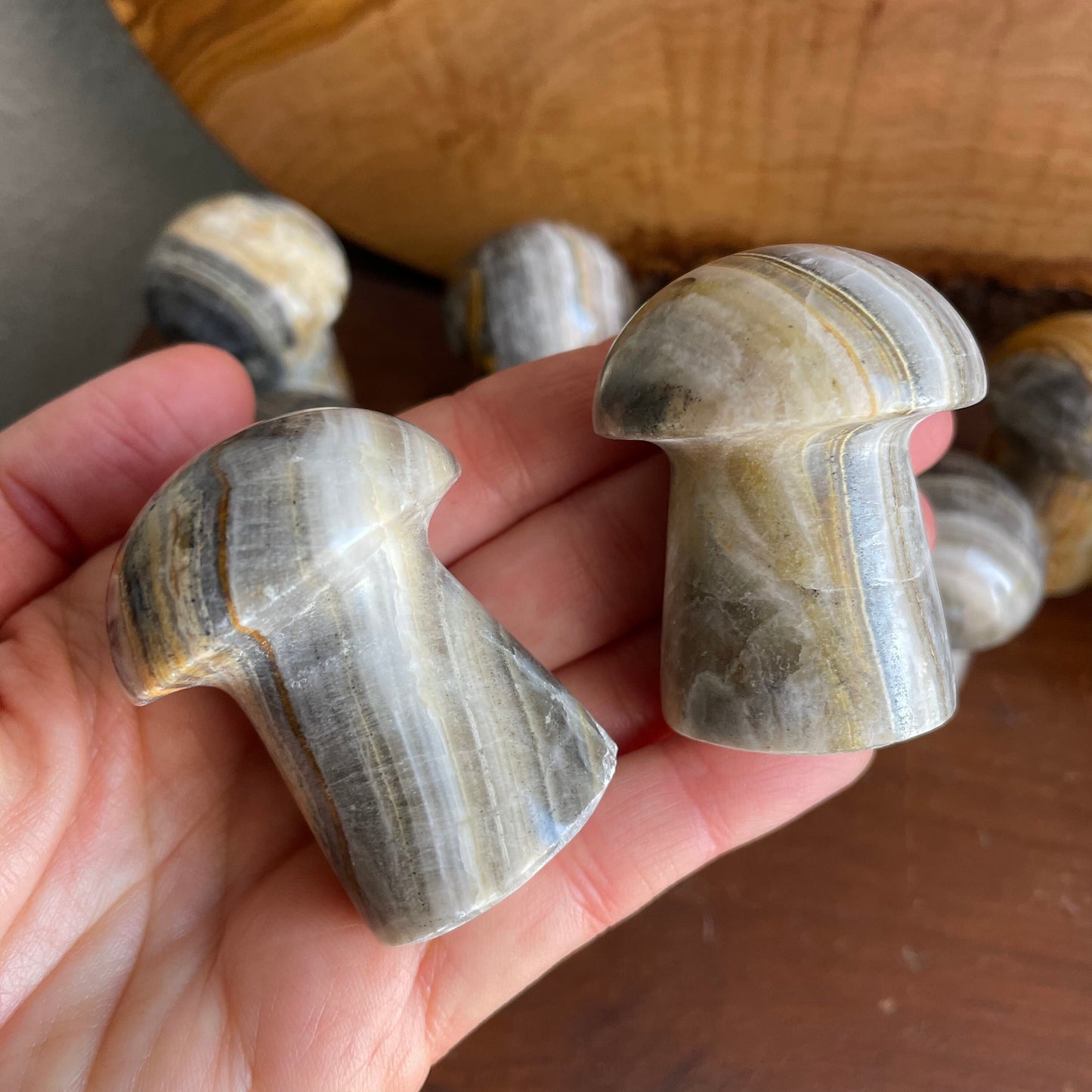 Embrace the calming presence of Zebra Calcite with our elegant Mushroom. Its earthy hues and mesmerizing stripes make it a perfect choice for enhancing your meditation and energy practices.