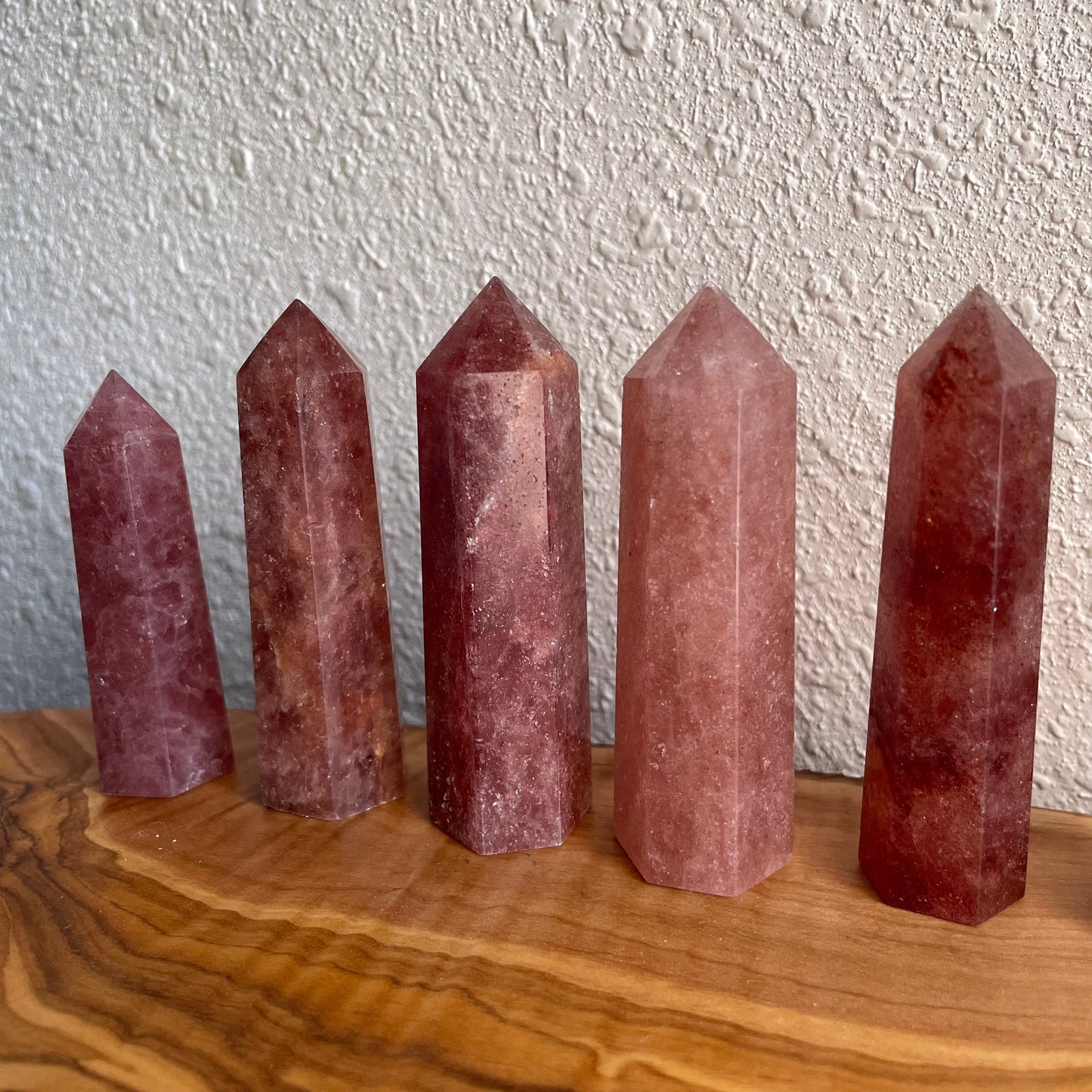 Enhance your crystal collection with the tender hues and uplifting energy of our Strawberry Quartz Tower.
